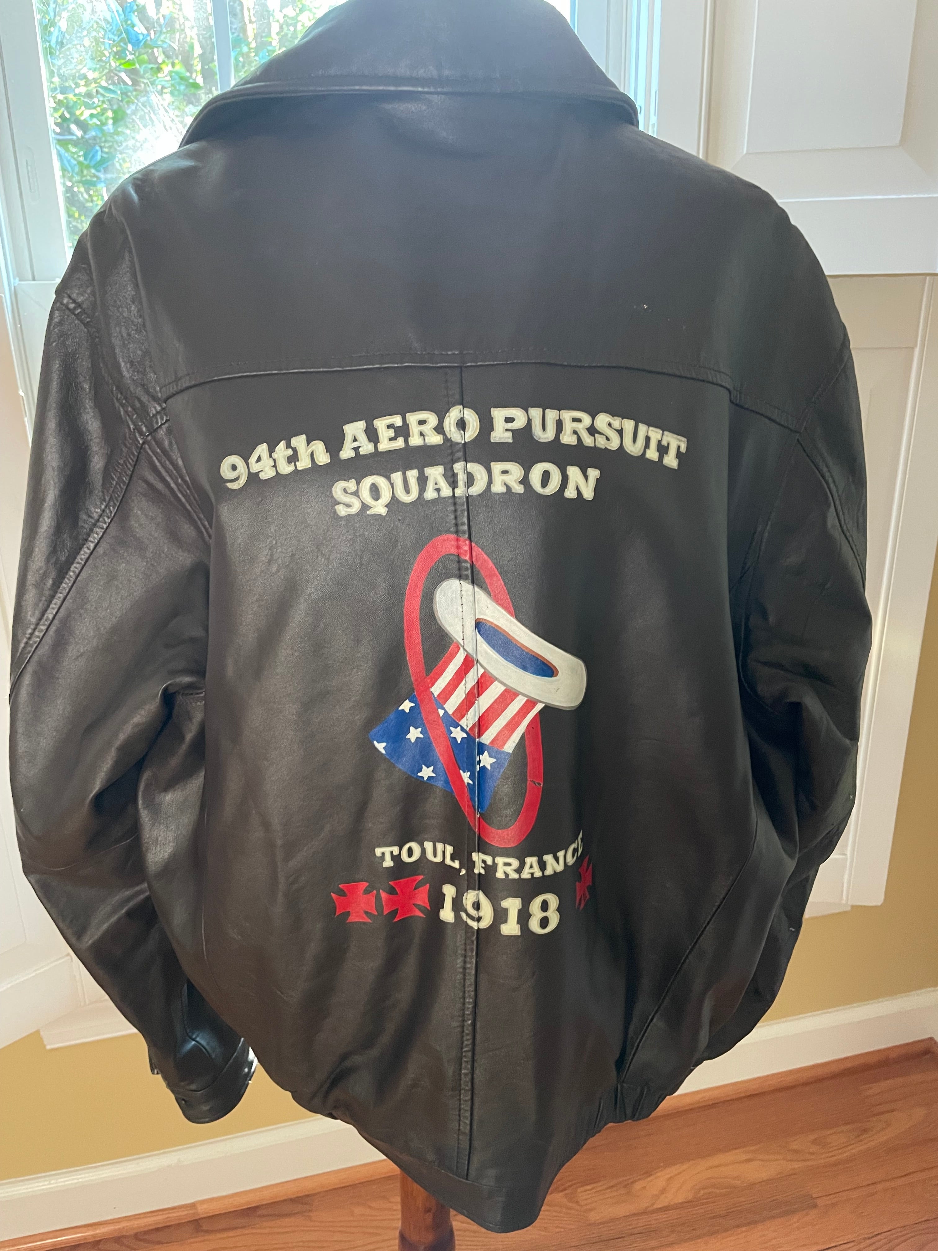 Seal brown jacket with hand painted design on a plain background