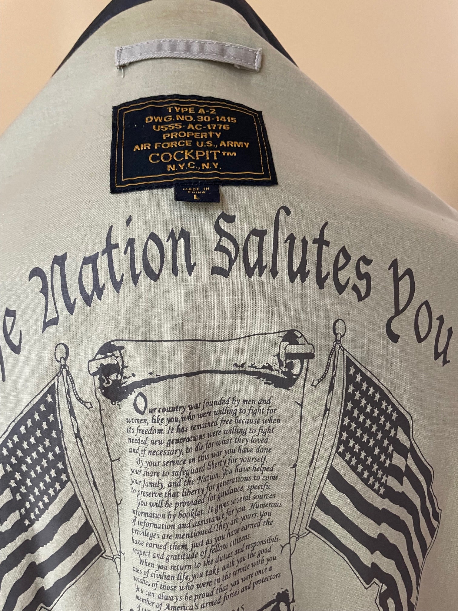 Cockpit A10 jacket inner liner with flags and patriotic message printed to surface