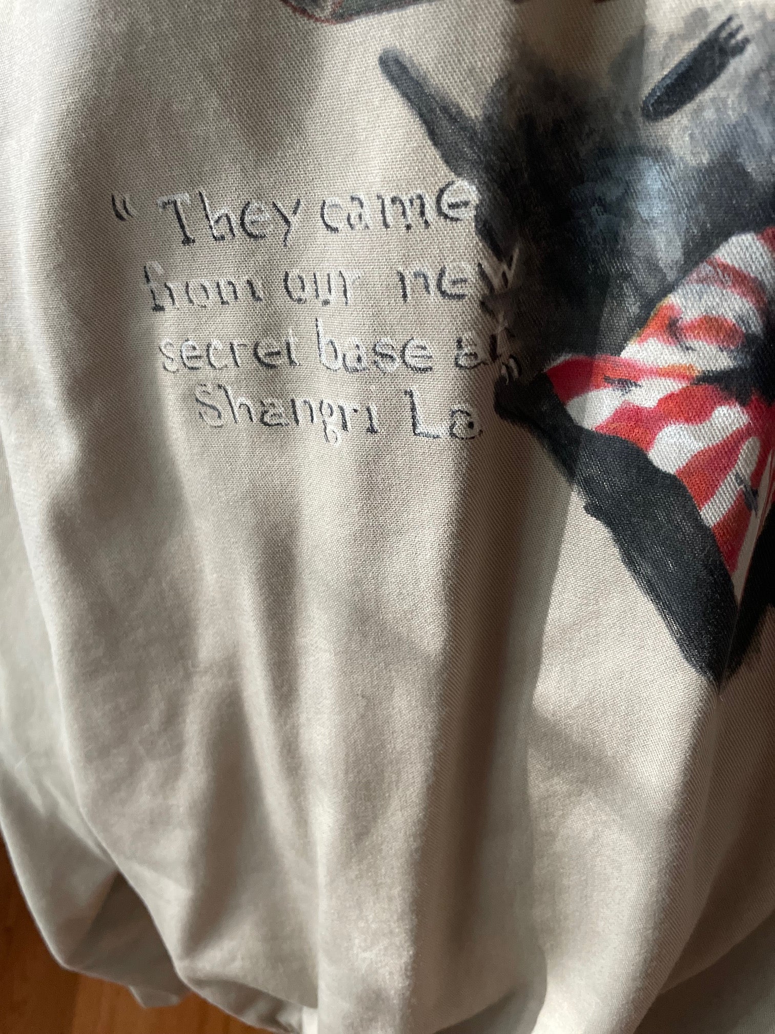 Closeup of text handpainted to canvas A10 jacket back