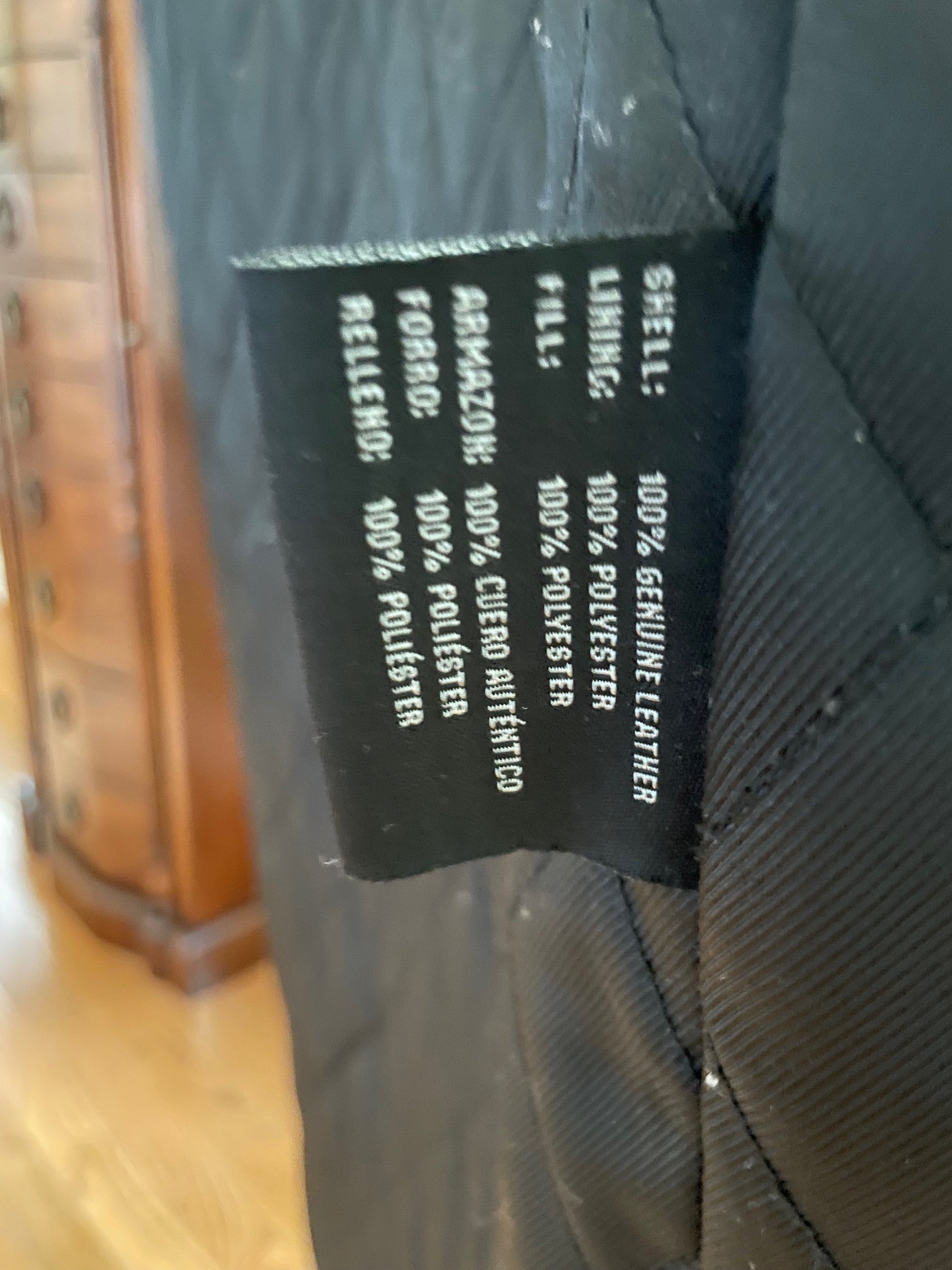 Greatcoat leather jacket Label detailing material composition.