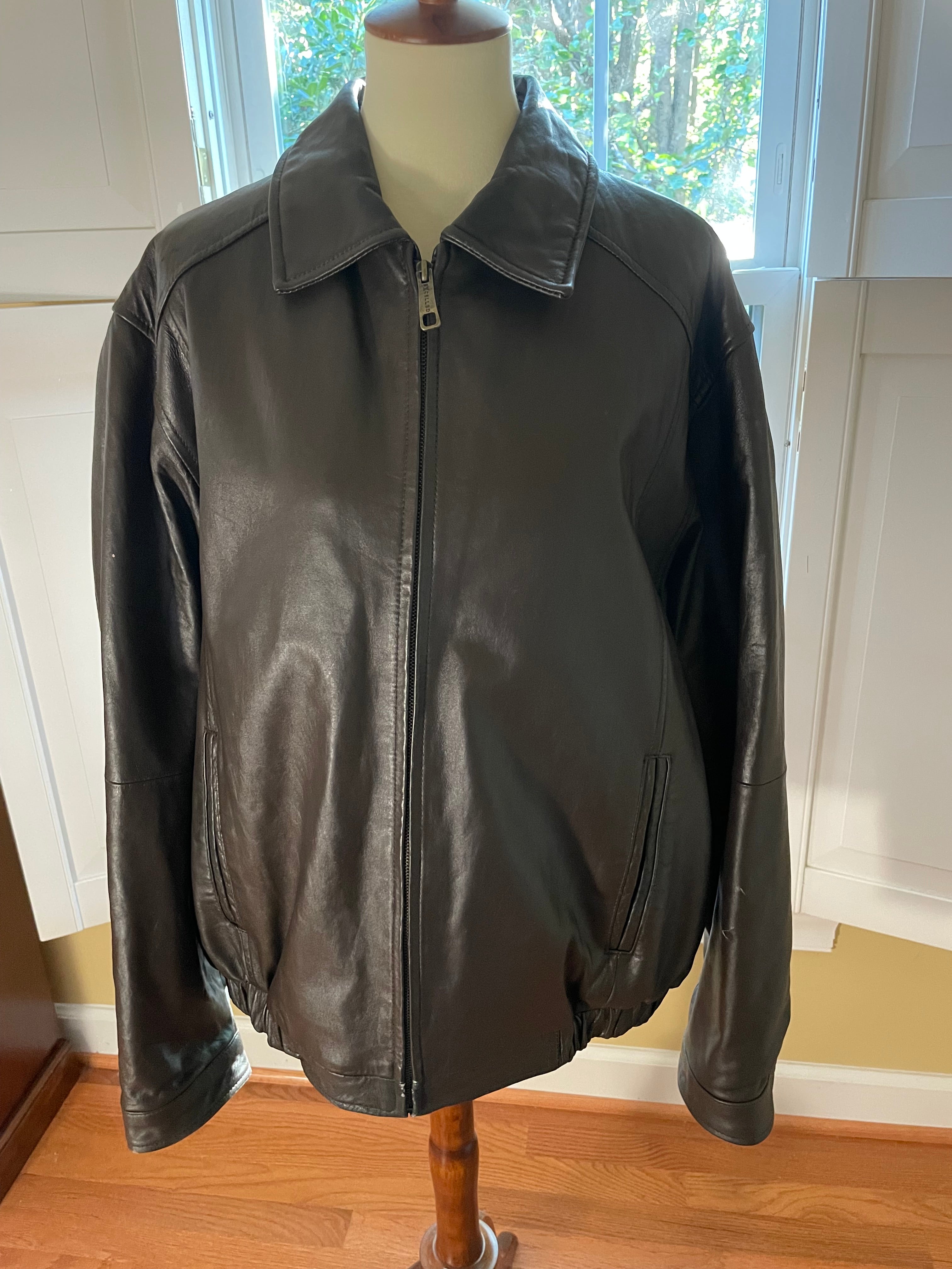 Seal brown leather jacket on a mannequin 