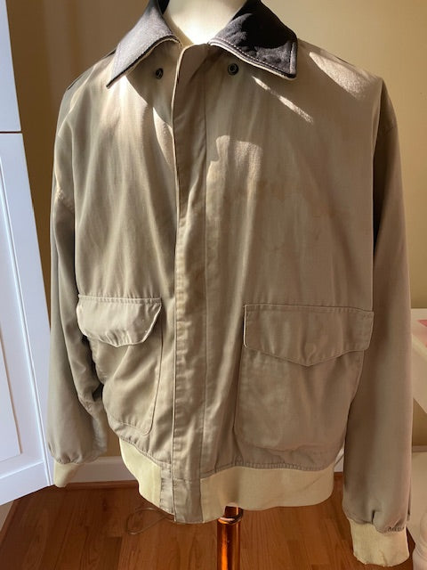 Beige A10 canvas jacket on a mannequin against a neutral background